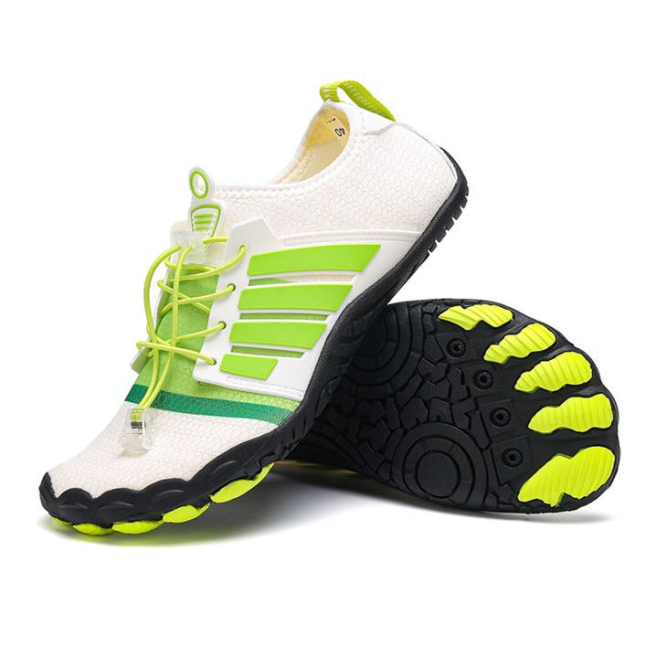 White water shoes with green accents and black soles on a white background